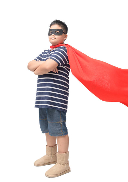 Fat child plays superhero isolated on white background, Boy power concept. - Photo, Image