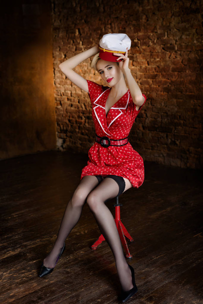 Beautiful young girl dressed at pin-up style - 写真・画像
