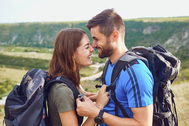 Happy couple of tourists  smiling in nature. - 写真・画像