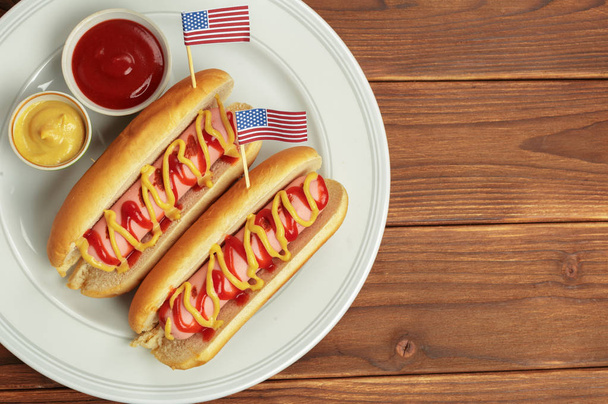 Hot dogs on wooden background - Фото, зображення