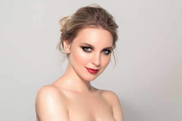 Beautiful model girl with blond hair and red lips. Beauty and esthetic care - Valokuva, kuva