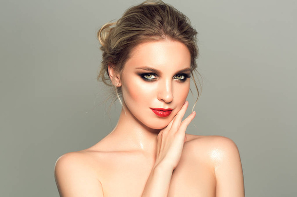 Beautiful model girl with blond hair and red lips. Beauty and esthetic care - Zdjęcie, obraz