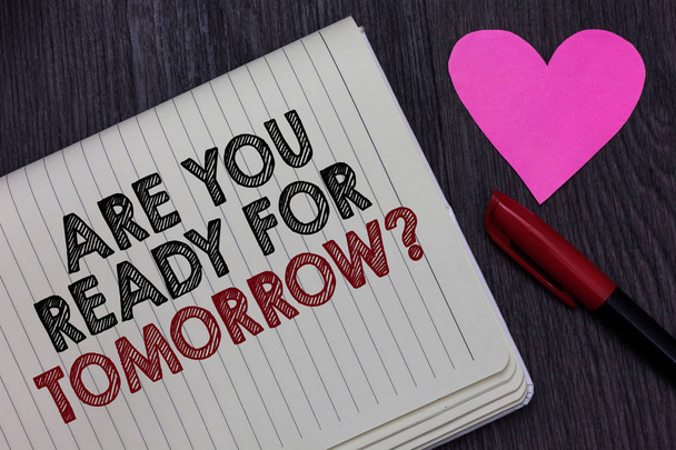 Пишу записку с вопросом "Готовы ли вы к завтрашнему дню?" Деловое фото, демонстрирующее подготовку к будущему Мотивация Яркие слова в блокноте Love Heart pen on blackish woody desk
 - Фото, изображение