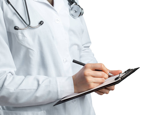 female doctor in uniform holding clipboard on white background - Foto, imagen