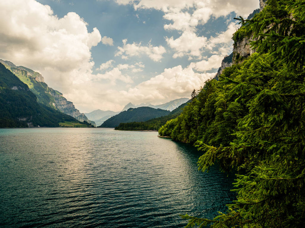 beautiful sunny mountain lake in the swiss alps, klontalersee switzerland - Photo, Image