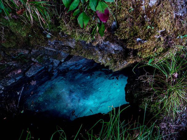 crazy blue water cave floatet with light blue watter, swiss alps - Foto, afbeelding