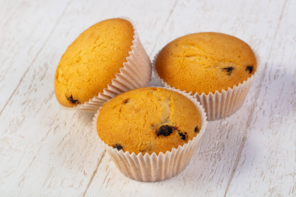 Sladké muffiny chutné dřevěné pozadí - Fotografie, Obrázek