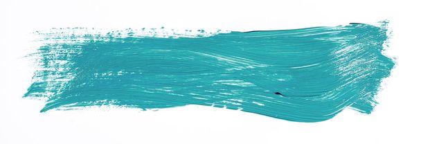 Turquoise penseelstreek geïsoleerd op witte achtergrond - Foto, afbeelding
