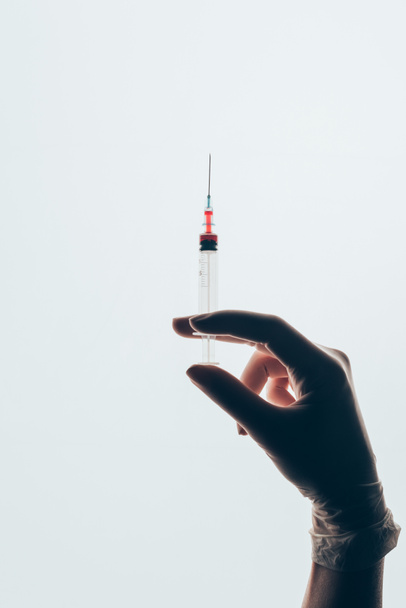 cropped shot of doctor holding syringe isolated on white - Valokuva, kuva