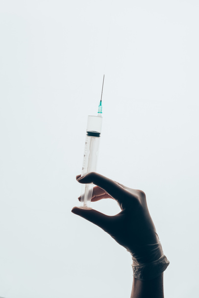 cropped shot of doctor in glove holding syringe isolated on white - Photo, Image