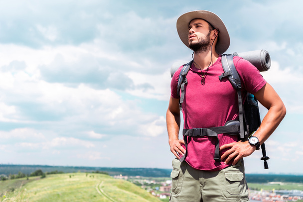 handsome hiker in hat with backpack and tourist mat - Photo, Image