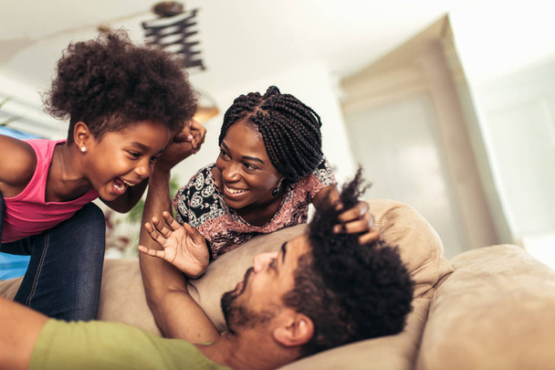 African american family spending time together at home. They are having fun - 写真・画像