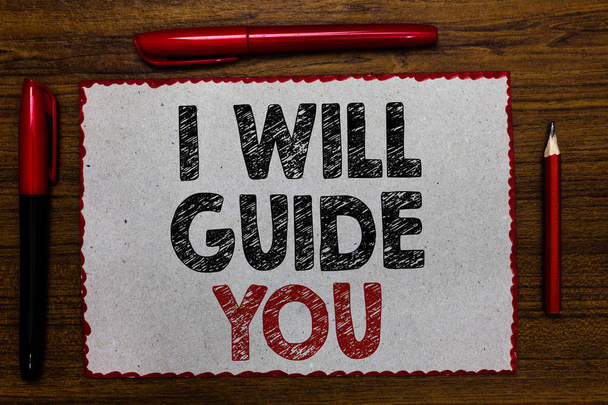 Text sign showing I Will Guide You. Conceptual photo Help showing a route Influence to do or think something Red bordered white page centered some texts wooden desk pen pencil - Photo, Image