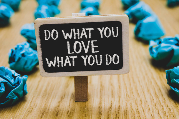 Handwriting text writing Do What You Love What You Do. Concept meaning Make things that motivate yourself Passion Stand blackboard with white words behind blurry blue paper lobs woody floor - Photo, Image