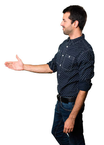 Brunette man making a deal on isolated white background - Photo, Image