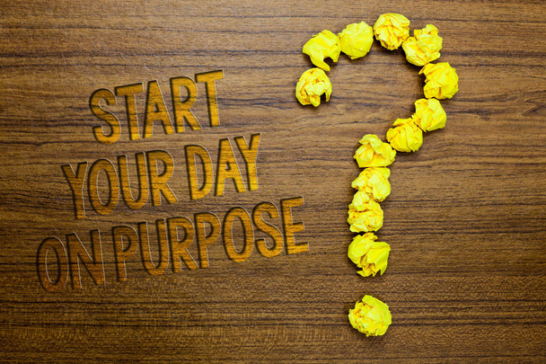 Word writing text Start Your Day On Purpose. Business concept for Have clean ideas of what you are going to do Wooden floor with some letters yellow paper lumps formed question mark - Photo, Image
