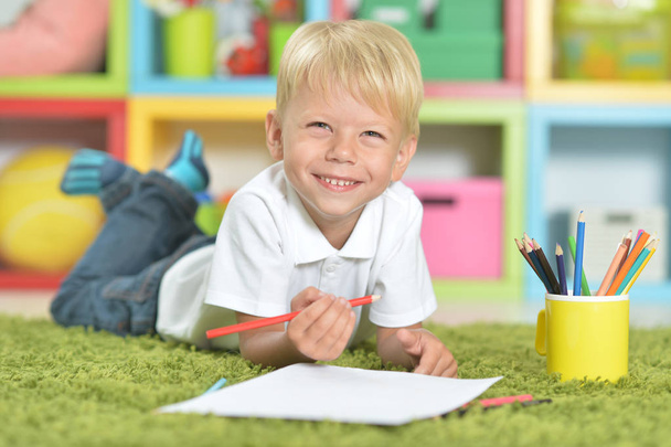 Portrait of cute little boy drawing with pencils - Foto, immagini