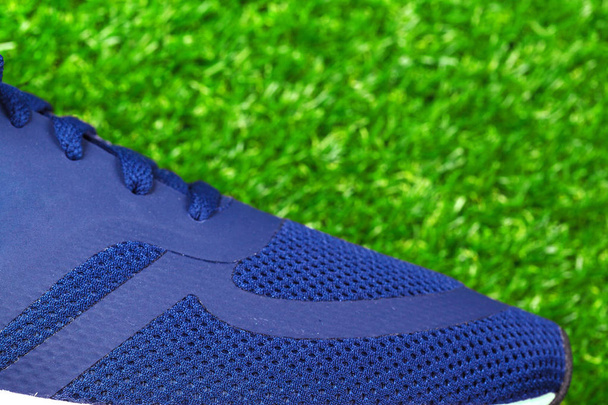 Close view of Sport shoes on grass - Foto, Imagen