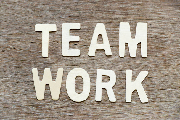 Alphabet letter in word teamwork on wood background - Photo, Image