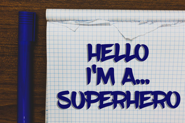 Writing note showing Hello I am A ... Superhero. Business photo showcasing Special powers Cartoon character Customs strenght Written white notepad on grey wooden background beside blue marker - Photo, Image