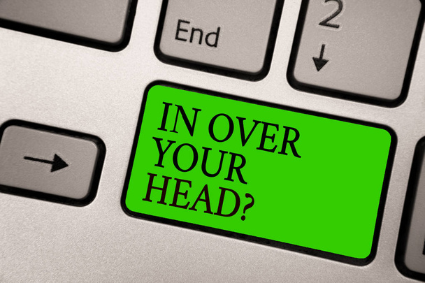Writing note showing In Over Your Head question. Business photo showcasing To be involved in a difficult situation problem Silver grey computer keyboard green button with black letters - Photo, Image