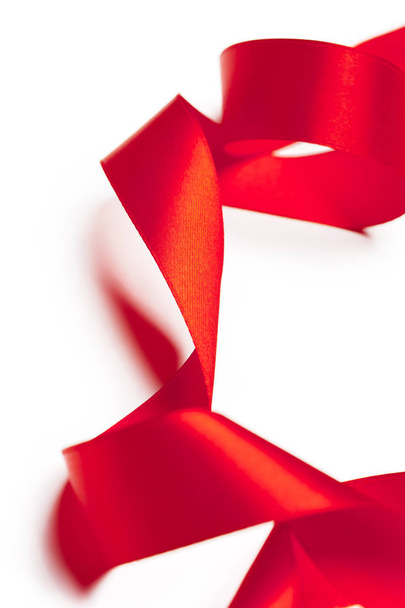 Red ribbon isolated on white background - 写真・画像