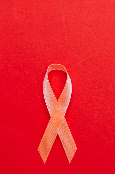 red ribbon as symbol of aids awareness - Fotografie, Obrázek
