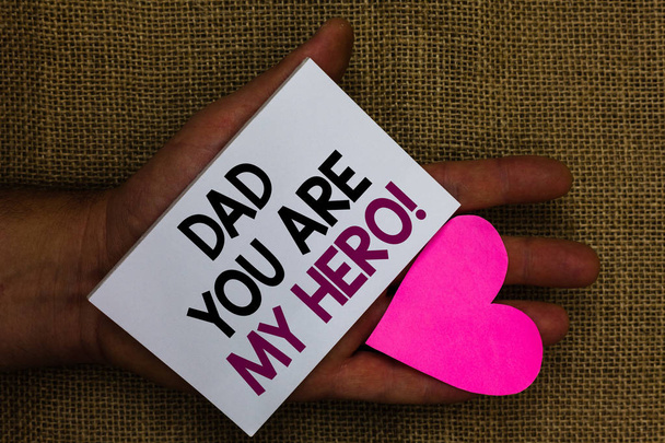 Word writing text Dad You Are My Hero. Business concept for Admiration for your father love feelings compliment Human hand touched white page with letter and love symbol sack base - Photo, Image