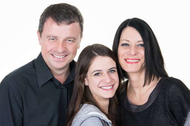 Happy family of three parents with their  pretty teenager daughter - Fotoğraf, Görsel