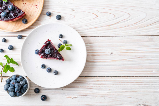 homemade blueberry cheese cake on wood background - Foto, Imagem