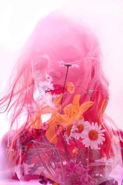 Woman with flowers inside, double exposure. Blonde girl in lingerie on crimson background, dreamy mysterious look. Wildflowers on a background of women with a double exposure on a light background - Фото, изображение