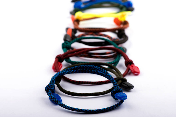 bracelets with threads. Braided bracelets. bracelet on the arm - Photo, Image