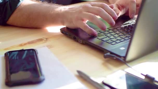 Business concept, hand using laptop at coffee shop, sun flares and toned image and free space for text - Footage, Video
