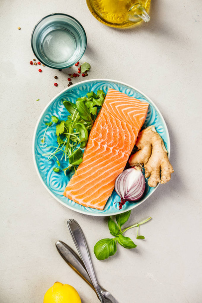Raw salmon fillet and ingredients for cooking - 写真・画像