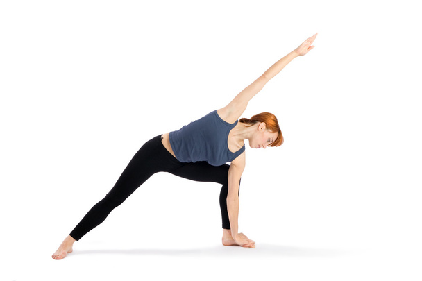 Woman Practising Yoga Exercise - 写真・画像