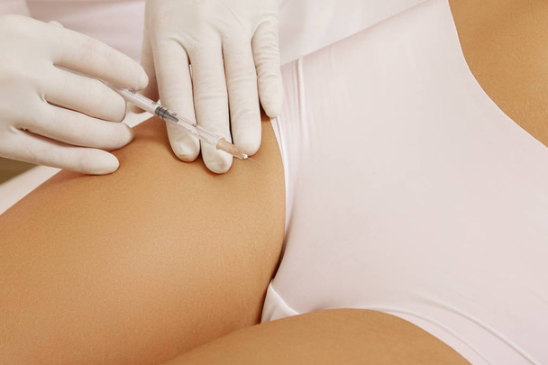 Woman got injection in the bikini zone. Concept of skin rejuvenation or gynecology. - Foto, Imagen