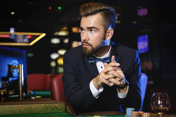 Rich handsome man playing roulette in the casino - Fotografie, Obrázek