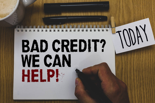Conceptual hand writing showing Bad Credit question We Can Help. Business photo text Borrower with high risk Debts Financial Written on paper hand hold pen clipper grip sticky note black pen - Photo, Image