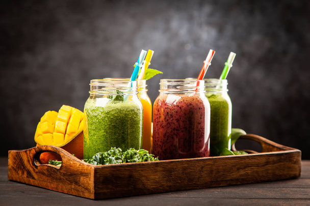 Assortment of green detox and fruit smoothies - Photo, Image