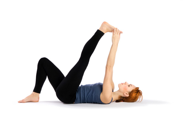 Woman doing Stretching Yoga Exercise - Foto, imagen