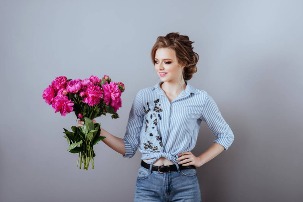 Fashion beautiful model with flowers , spring look. - Photo, image