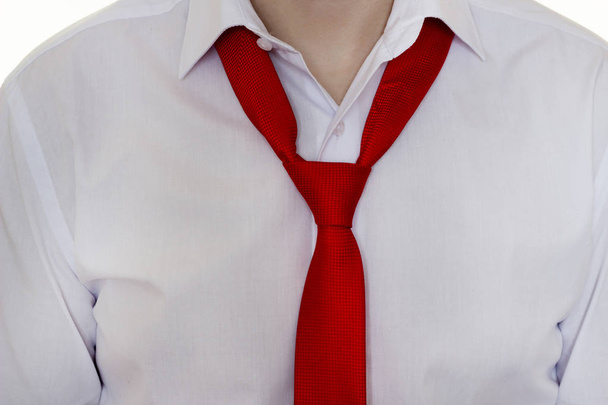 A man in a white shirt and red tie, tie is not tied up, close-up - Fotoğraf, Görsel