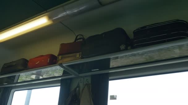 Luggage on train car on the up shelves - Footage, Video