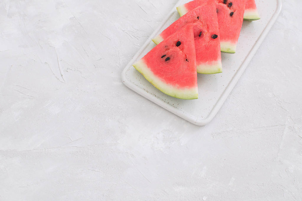Fresh red watermelon slice Isolated White background Selective focus Copy space Perspective Summer concept Minimal picture - Foto, Imagem
