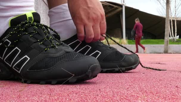 Athlete Tying Sneaker Lace - Кадры, видео