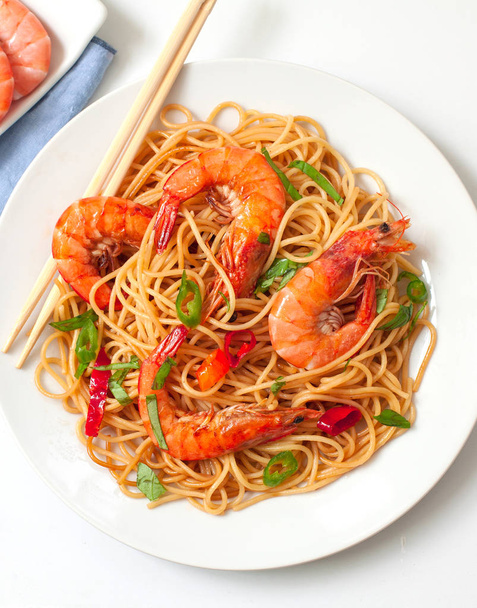 thai style noodles with prawns and chili on a dish - Fotoğraf, Görsel