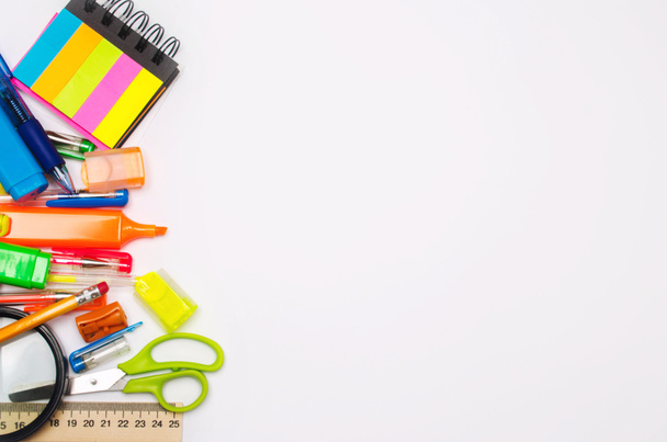 school accessories on a white background. stationery. back to school. concept of education. desk. color pens, pencils, ruler, alarm clock. place for text. copy space. view from above. flat lay - Φωτογραφία, εικόνα