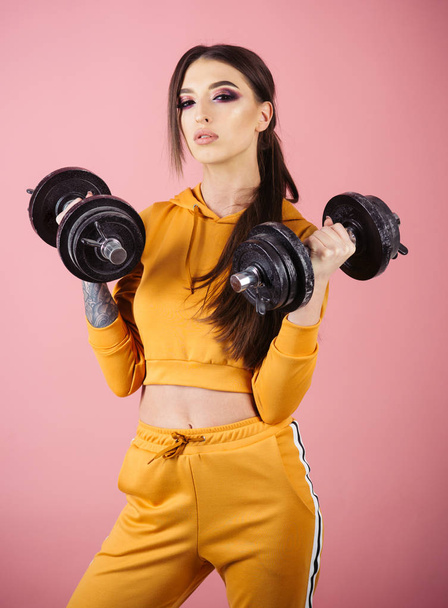 strength. great progress. strength and power. strength of sexy woman holding dumbbells. - Photo, Image
