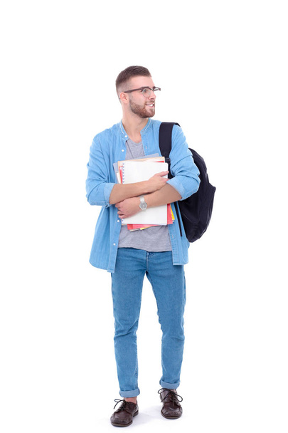 A male student with a school bag holding books isolated on white background. Education opportunities. College student. - Foto, imagen