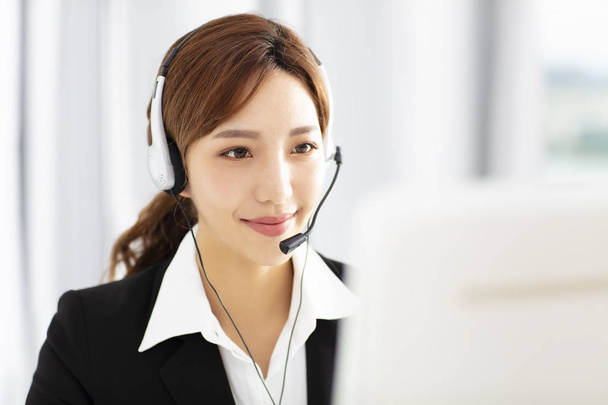 beautiful young business woman operator in headset - Photo, Image